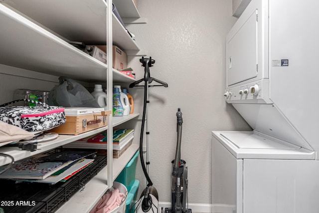 520 N Stapley Dr Unit 286, Mesa, AZ 85203 - clothes washing area featuring laundry area, stacked washing maching and dryer, baseboards, and a textured wall