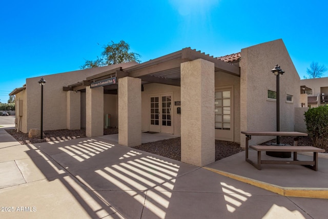 520 N Stapley Dr Unit 286, Mesa, AZ 85203 - back of property featuring a patio, french doors, and stucco siding