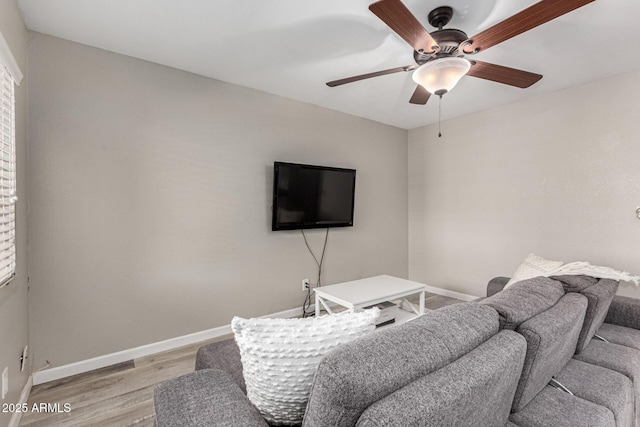 520 N Stapley Dr Unit 286, Mesa, AZ 85203 - living room featuring a ceiling fan, baseboards, and light wood-type flooring