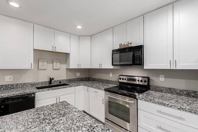 520 N Stapley Dr Unit 286, Mesa, AZ 85203 - kitchen featuring black appliances, white cabinets, light stone counters, and a sink