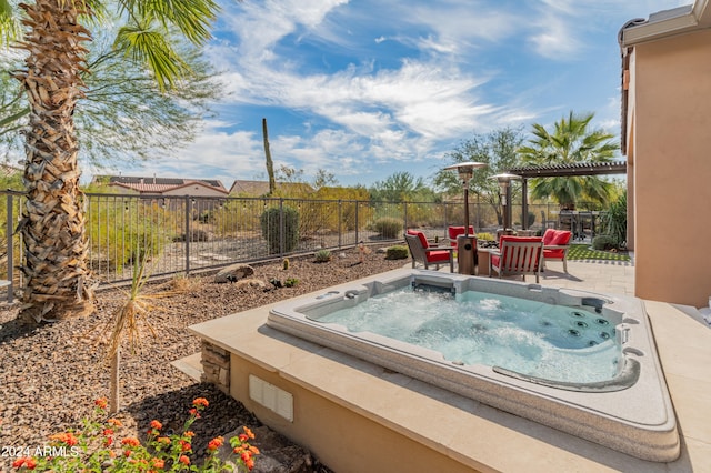 view of swimming pool featuring a patio area and an outdoor hot tub