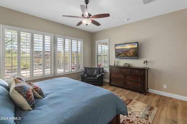 bedroom featuring light hardwood / wood-style flooring and ceiling fan