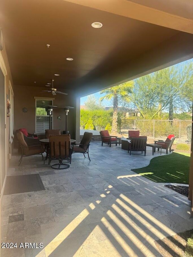 view of patio featuring an outdoor living space and ceiling fan