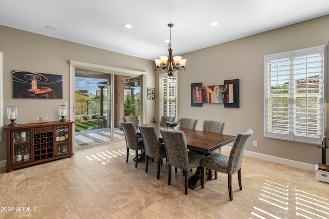 dining space with a chandelier