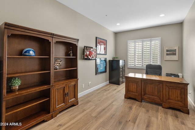 office area with light hardwood / wood-style floors