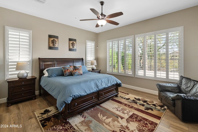 bedroom featuring light hardwood / wood-style floors and ceiling fan