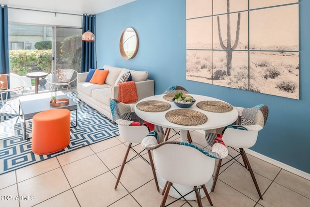 tiled dining room with baseboards