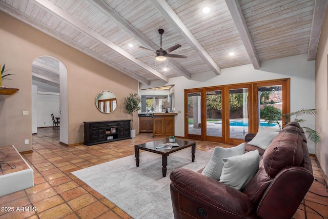 living room with wood ceiling, ceiling fan, sink, and vaulted ceiling with beams