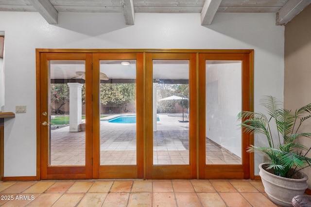 entryway with wooden ceiling, french doors, and beamed ceiling