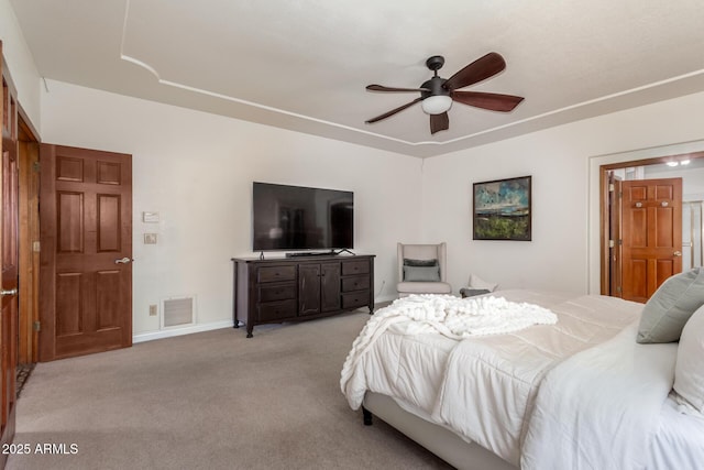 bedroom featuring ceiling fan and light carpet