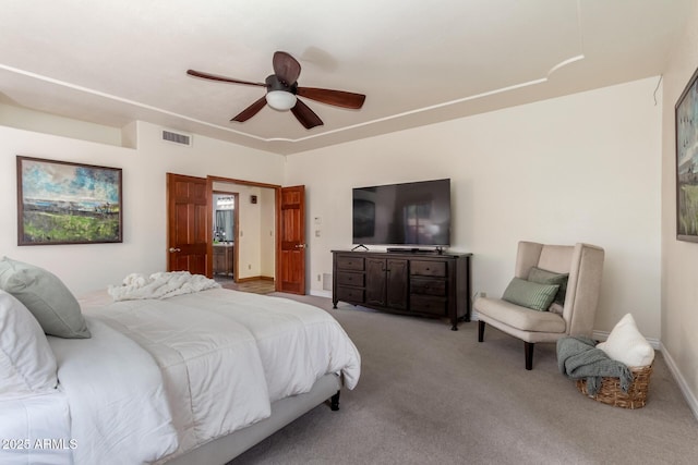 bedroom with ceiling fan and light carpet