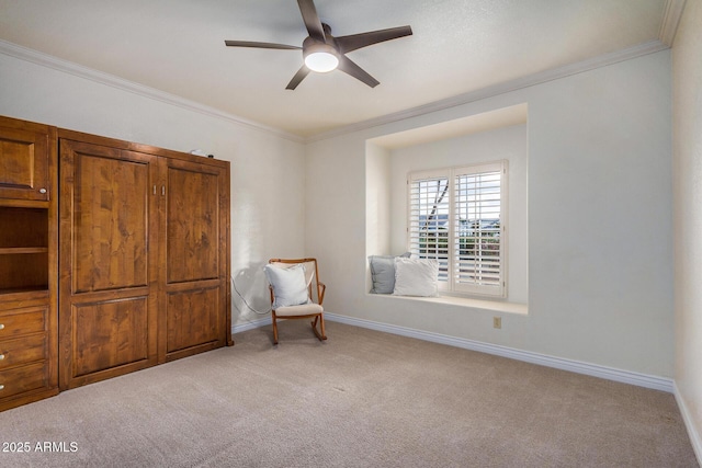 living area with ceiling fan, ornamental molding, and light carpet