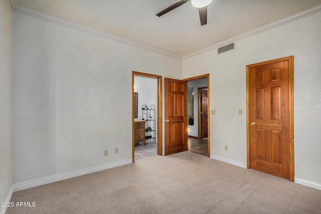 unfurnished bedroom with crown molding, light carpet, and ceiling fan