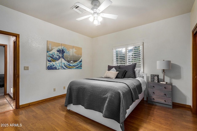 bedroom featuring hardwood / wood-style flooring and ceiling fan