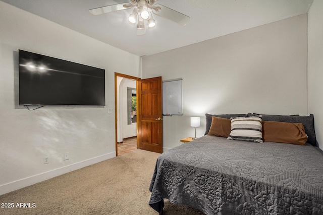 bedroom with ceiling fan and light carpet