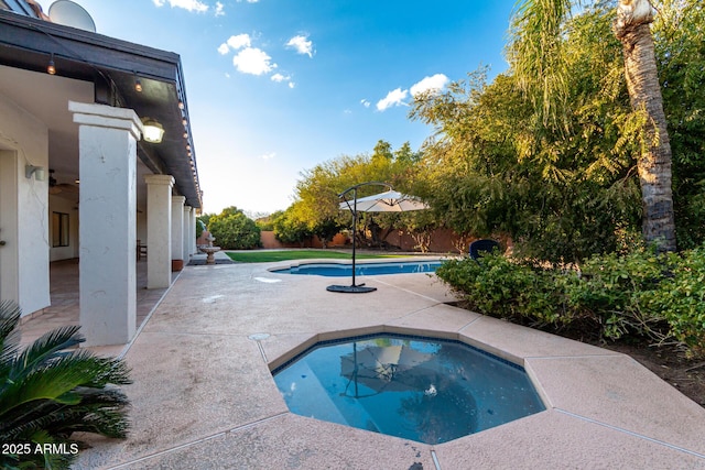 view of swimming pool with a patio area