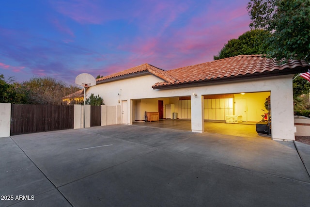 exterior space featuring basketball hoop