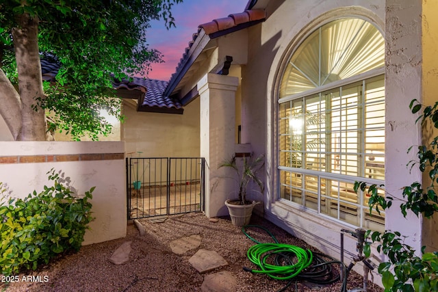 view of property exterior at dusk