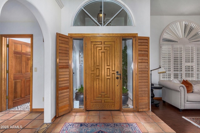 entrance foyer featuring a towering ceiling