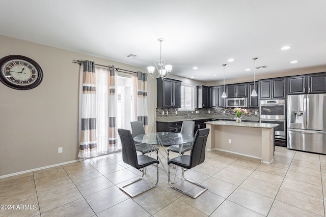 dining space with light tile patterned flooring, visible vents, recessed lighting, and baseboards