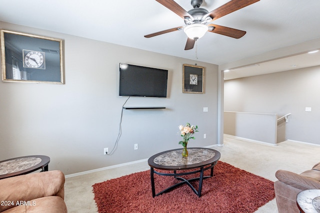 living room with carpet and ceiling fan