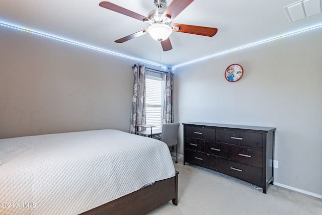 bedroom featuring light carpet and ceiling fan