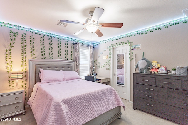 bedroom with ceiling fan and light colored carpet