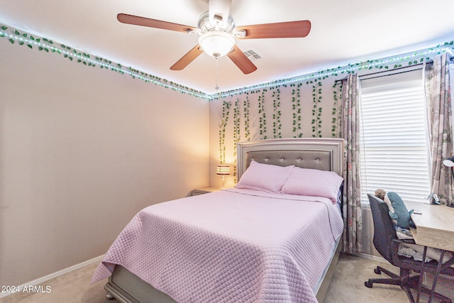 bedroom featuring ceiling fan and carpet