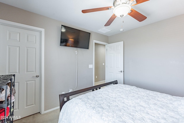 carpeted bedroom featuring ceiling fan