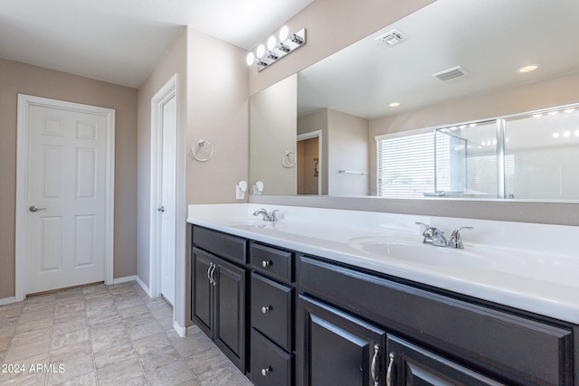 bathroom with an enclosed shower and vanity