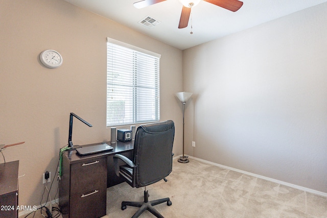 office with light carpet and ceiling fan