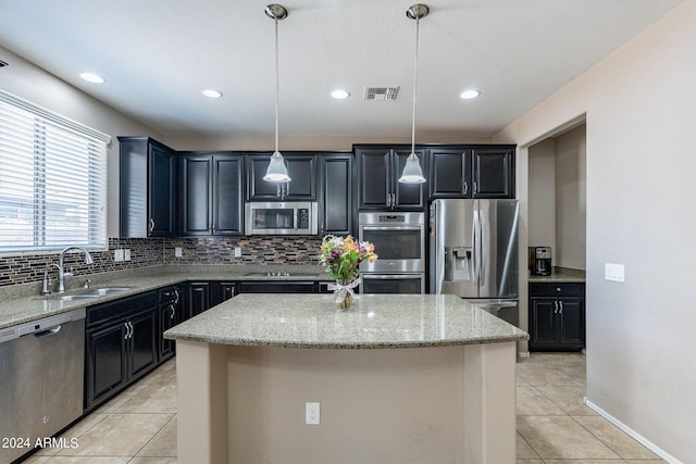 kitchen with visible vents, backsplash, light tile patterned floors, appliances with stainless steel finishes, and a sink