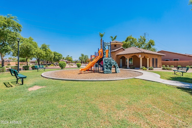 view of playground with a lawn