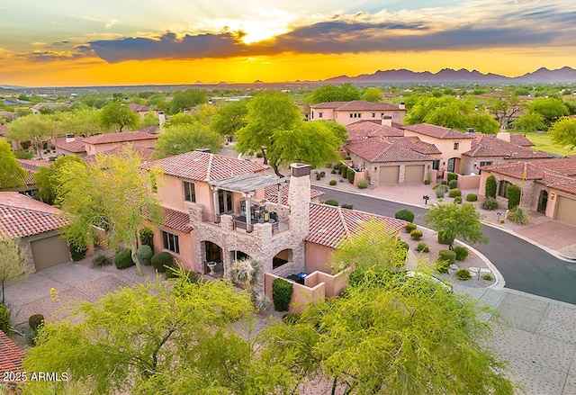 7751 E Golden Eagle Cir, Gold Canyon, AZ 85118 - aerial view at dusk of a residential view and a mountain view