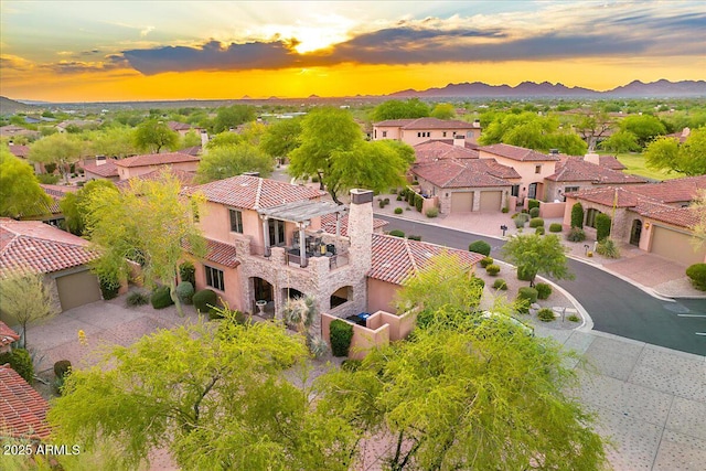 7751 E Golden Eagle Cir, Gold Canyon, AZ 85118 - aerial view at dusk of a residential view and a mountain view