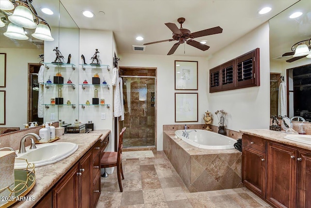 7751 E Golden Eagle Cir, Gold Canyon, AZ 85118 - full bath featuring a ceiling fan, a stall shower, two vanities, a garden tub, and recessed lighting