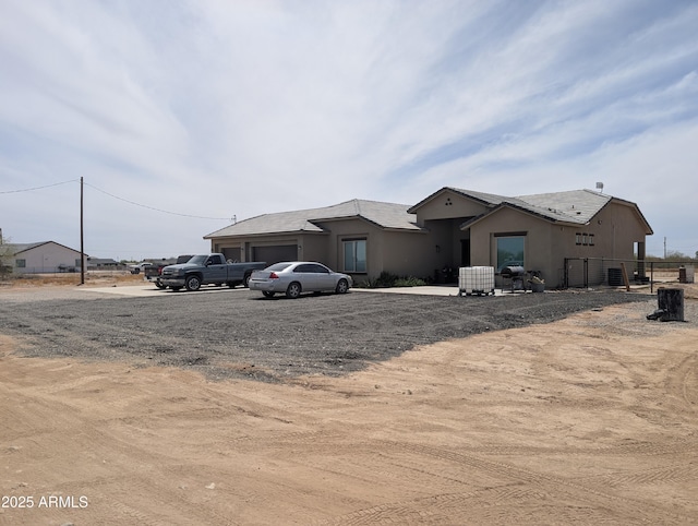 28624 N Susan Ln, Florence, AZ 85132 - view of front facade featuring stucco siding and a garage
