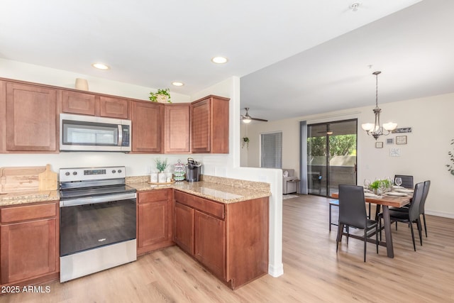 kitchen with light stone counters, brown cabinetry, appliances with stainless steel finishes, and light wood-type flooring