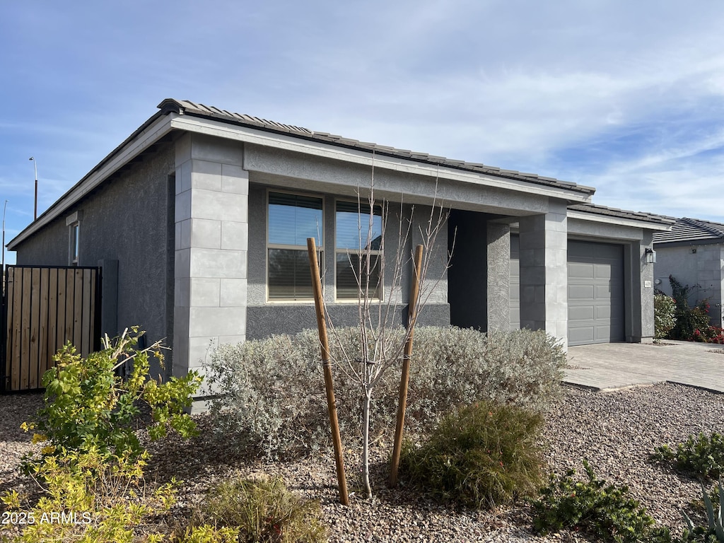 view of side of property with a garage