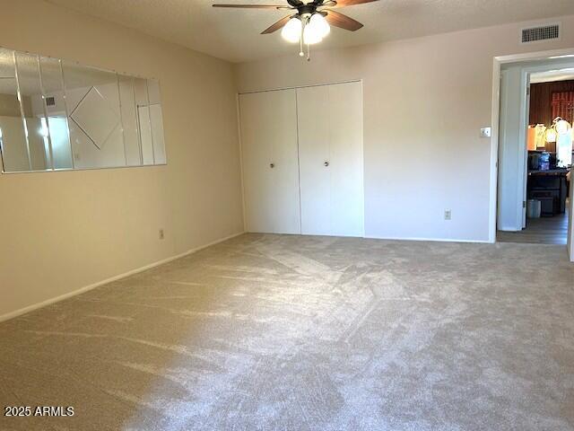3242 W Christy Dr, Phoenix, AZ 85029 - unfurnished bedroom with a closet, visible vents, and carpet