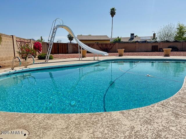 3242 W Christy Dr, Phoenix, AZ 85029 - view of swimming pool featuring a fenced backyard, a fenced in pool, and a water slide