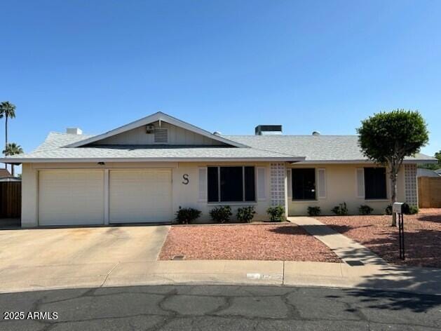 3242 W Christy Dr, Phoenix, AZ 85029 - single story home with driveway, stucco siding, an attached garage, and roof with shingles
