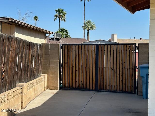 3242 W Christy Dr, Phoenix, AZ 85029 - view of gate featuring central air condition unit and fence