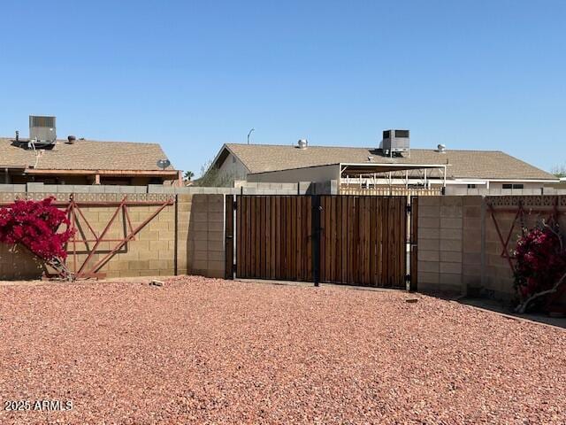 3242 W Christy Dr, Phoenix, AZ 85029 - view of yard with a gate, fence, and central AC