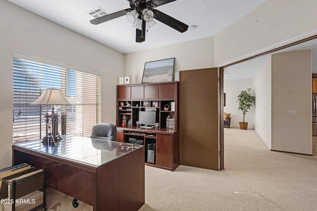 office area with ceiling fan and light colored carpet