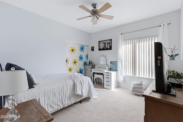 carpeted bedroom with ceiling fan