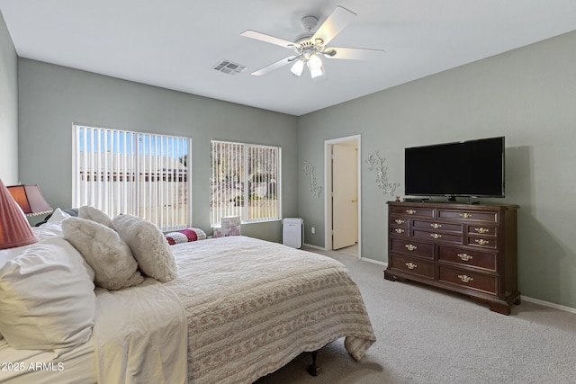 bedroom with light carpet and ceiling fan