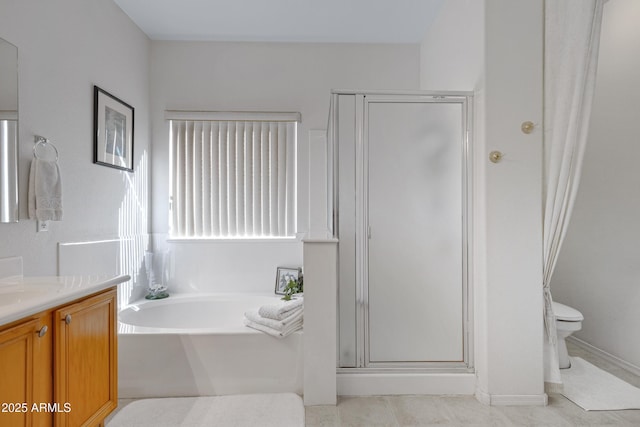 full bathroom featuring toilet, vanity, and shower with separate bathtub