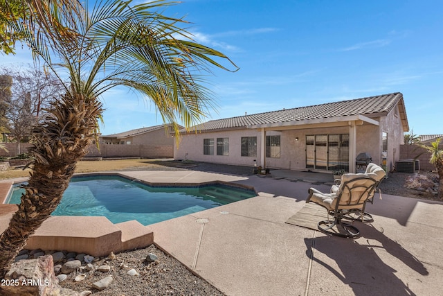 view of pool with central AC unit and a patio