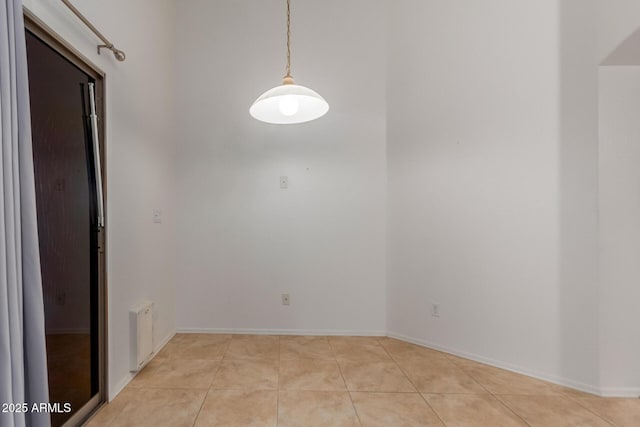 12132 W Caribbean Ln, El Mirage, AZ 85335 - empty room with light tile patterned floors and baseboards